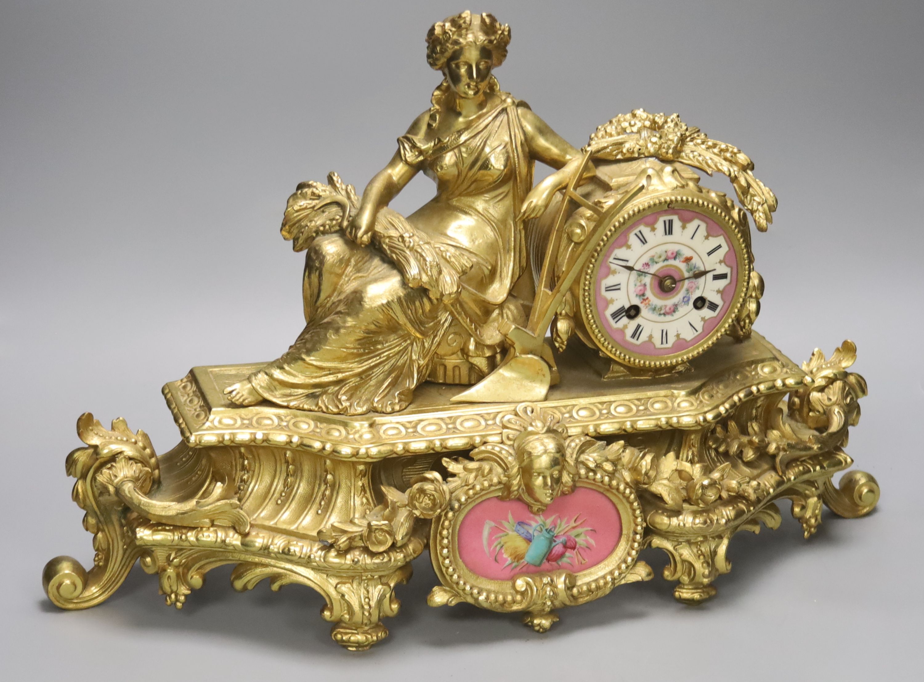 A late 19th century French gilt brass figural mantel clock, Sevres style plaques, length 47cm